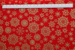 Klar rød julepatchworkstof med guld iskrystaller