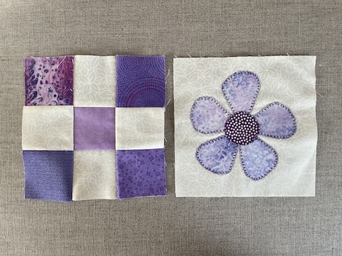 Blomster og firkanter giver smukt Østermarie baby tæppe