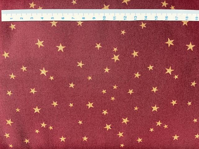 Jule bomuldsstof bred guld stjerner - Mørkerød