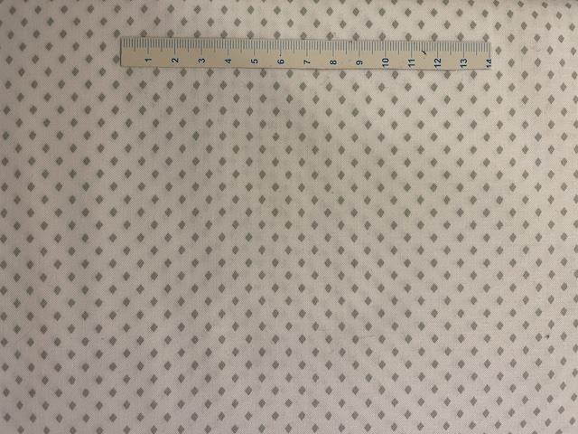 Lyst patchworkstof med grå romber