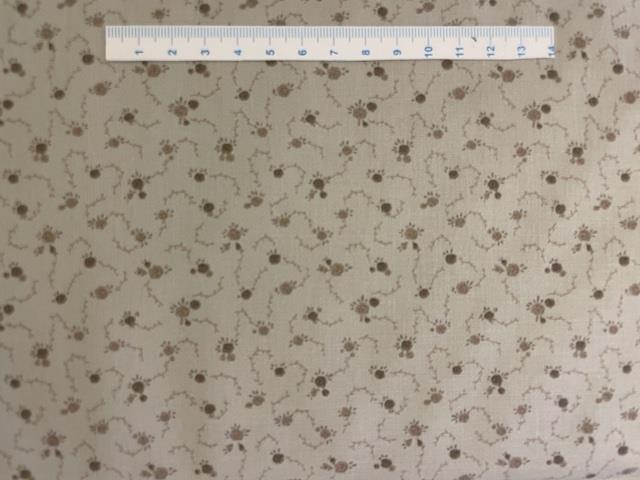 Beige patchworkstof med mønster