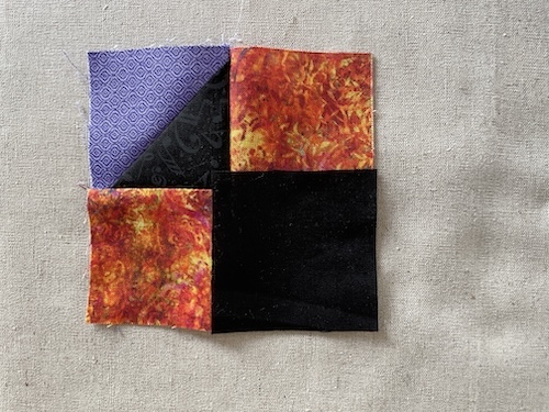 Strimler med trekanter er smukt Holte restetæppe