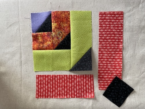 Strimler med trekanter er smukt Holte restetæppe