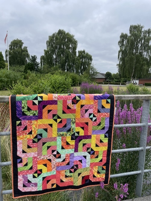 Strimler med trekanter er smukt Holte restetæppe