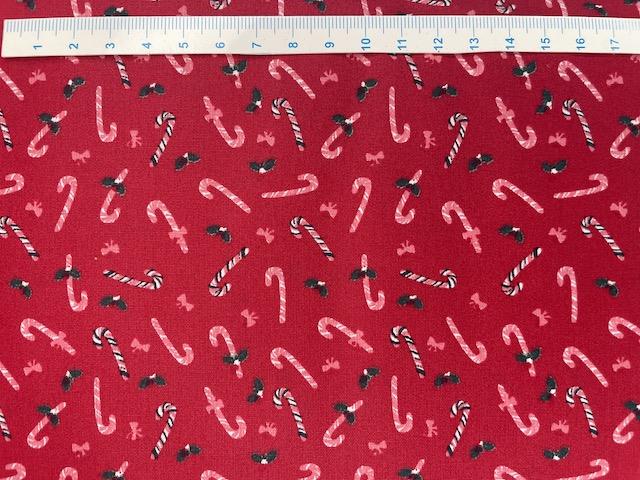 Sukkerstokker på brede rød bomuldsstof 