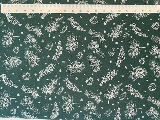 Kogler og grene på bred grøn bomuldsstof 