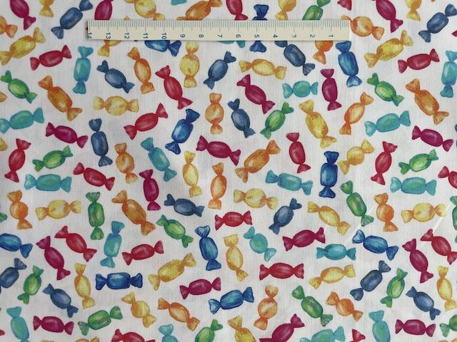 Farverige bolcher på bred bomuldsstof