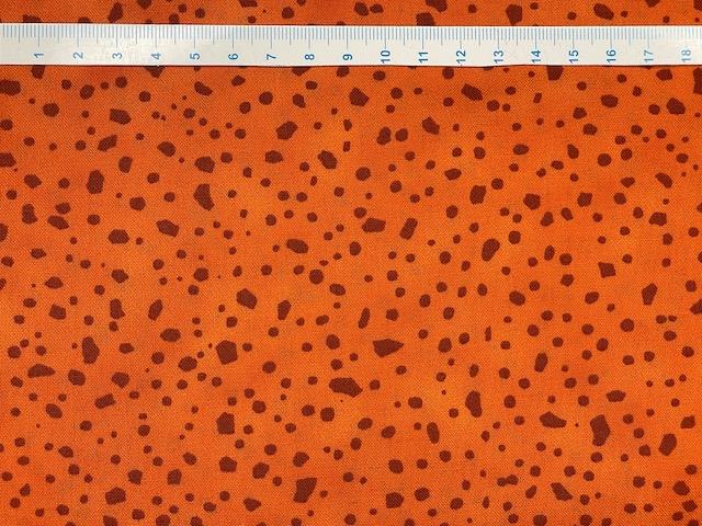 Orange patchworkstof - med uens "klatter"