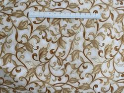 Beige patchworkstof med grene og blade