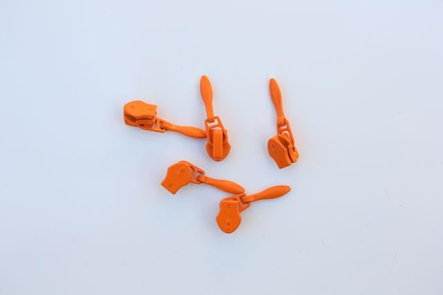Alperne frø Skrøbelig Dråbeformet orange glider/skyder passer til 4 mm lynlåse i metermål. Nemt  at sætte på.Lav pris og hurtig levering.